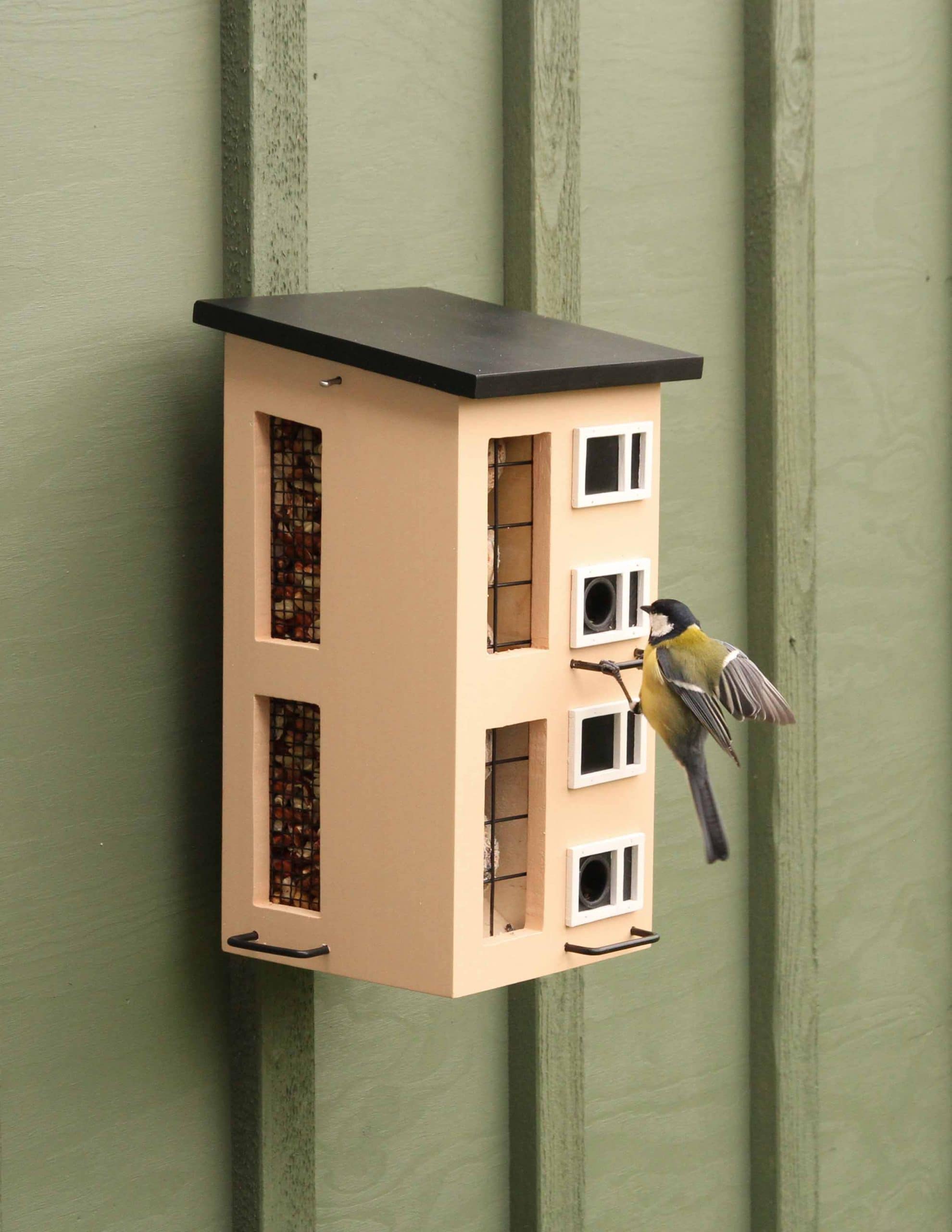 Picture of WG254 triple feeder yellow in environment with bird